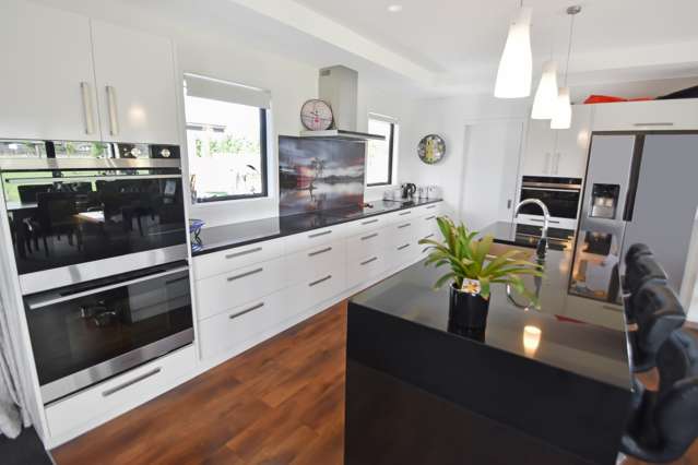 Finished kitchen with island bench and full appliance fit-out