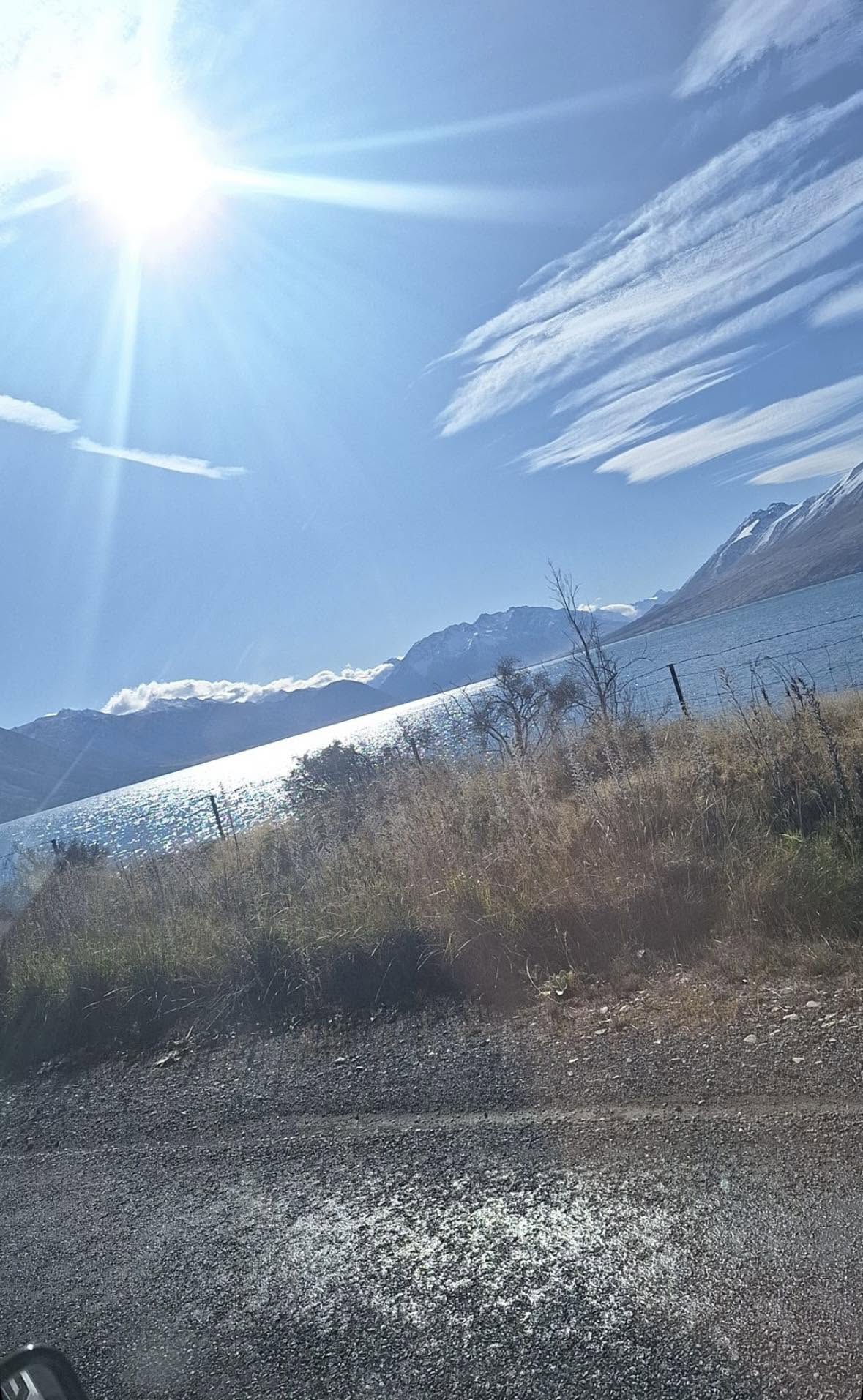 Looking across a Mackenzie lake to the snow-topped ranges